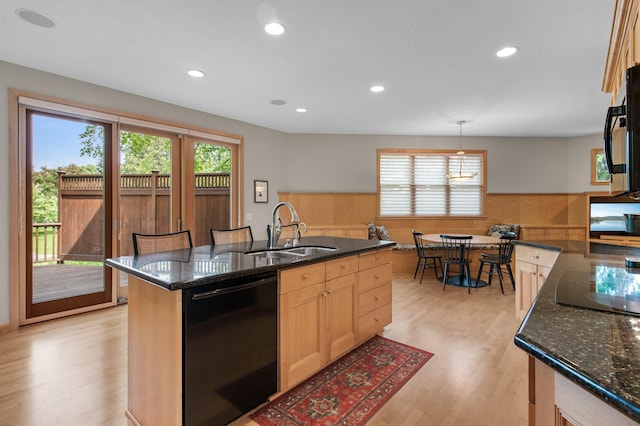3933 Donegal Way, Eagan, MN 55122 - kitchen with black appliances, healthy amount of natural light, a wainscoted wall, light wood-style floors, and light brown cabinetry