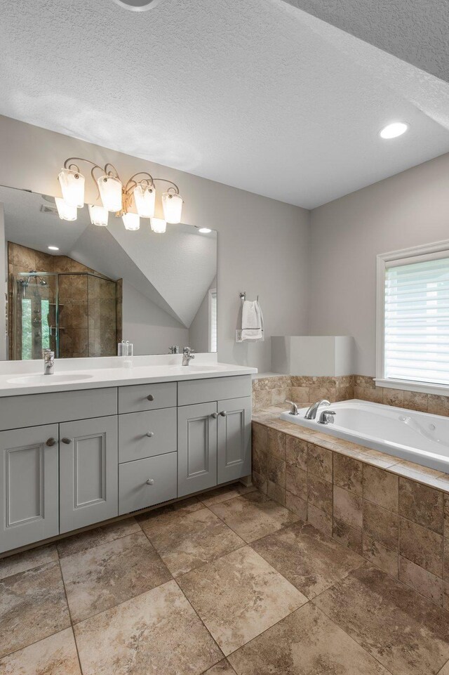 3933 Donegal Way, Eagan, MN 55122 - full bath featuring double vanity, a shower stall, a garden tub, and a textured ceiling