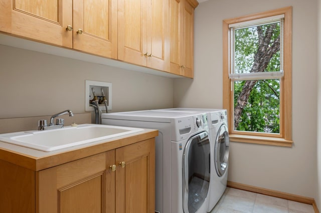 3933 Donegal Way, Eagan, MN 55122 - laundry area featuring cabinet space, washing machine and clothes dryer, and light tile patterned floors