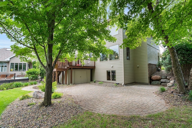 3933 Donegal Way, Eagan, MN 55122 - back of house featuring a patio, a deck, and driveway