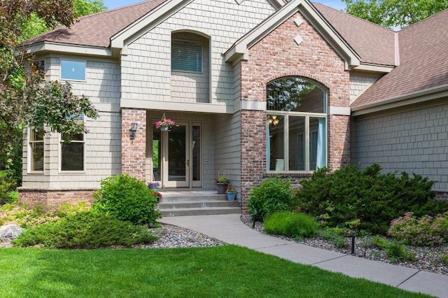 3933 Donegal Way, Eagan, MN 55122 - view of front of property featuring roof with shingles, brick siding, and a front yard