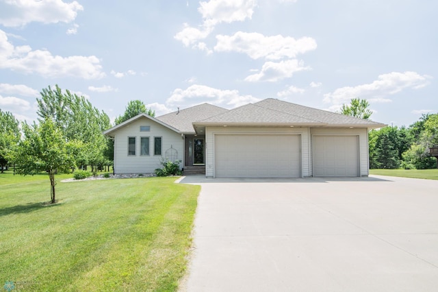 633 Leonards Way, Argusville, ND 58005 - view of front of house featuring concrete driveway, an attached garage, and a front lawn