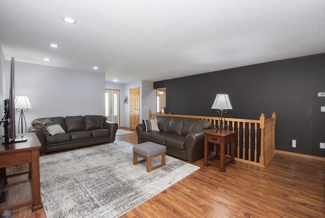633 Leonards Way, Argusville, ND 58005 - living area with wood finished floors, recessed lighting, and a textured ceiling
