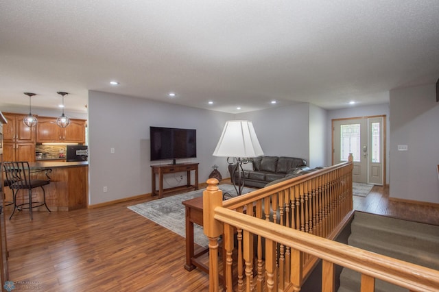 633 Leonards Way, Argusville, ND 58005 - living room featuring wood finished floors and recessed lighting