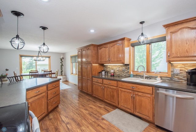 633 Leonards Way, Argusville, ND 58005 - kitchen with stainless steel dishwasher, dark countertops, light wood finished floors, stove, and recessed lighting