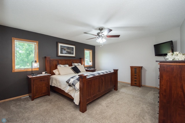 633 Leonards Way, Argusville, ND 58005 - bedroom with light colored carpet and a ceiling fan