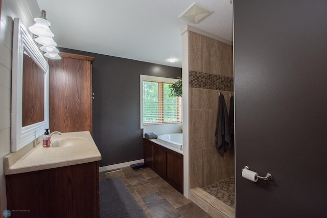 633 Leonards Way, Argusville, ND 58005 - bathroom featuring vanity, a bath, and a tile shower