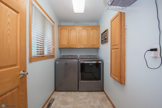 633 Leonards Way, Argusville, ND 58005 - laundry area with separate washer and dryer and cabinet space