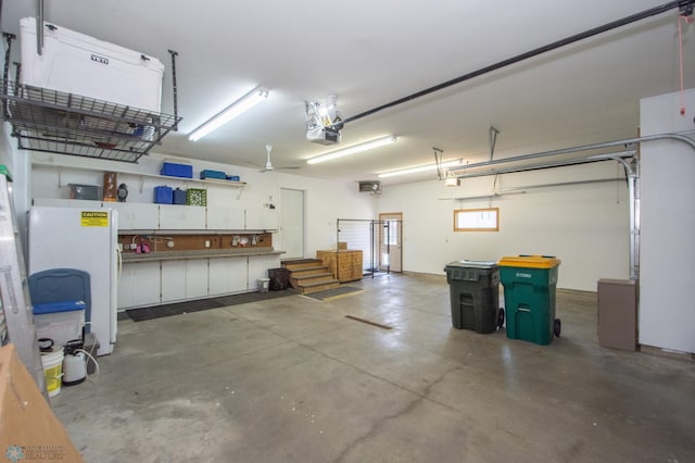 633 Leonards Way, Argusville, ND 58005 - garage featuring fridge and a garage door opener