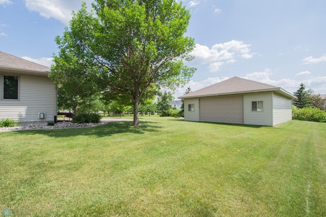 633 Leonards Way, Argusville, ND 58005 - view of grassy yard featuring a detached garage and an outdoor structure