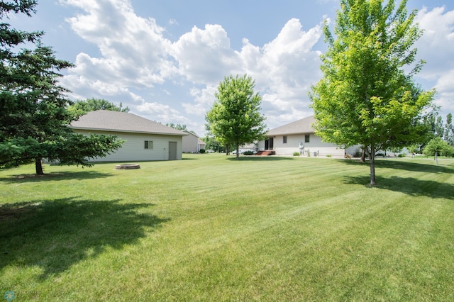 633 Leonards Way, Argusville, ND 58005 - view of grassy yard with a fire pit