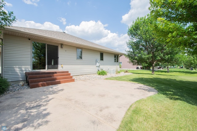 633 Leonards Way, Argusville, ND 58005 - back of property featuring a yard, a patio area, and entry steps