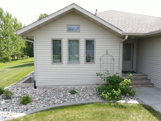 633 Leonards Way, Argusville, ND 58005 - view of side of home featuring a lawn and a shingled roof