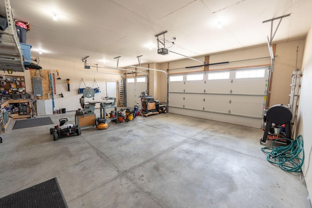 695 Marcus Pl NE, Byron, MN 55920 - garage with a garage door opener and electric panel