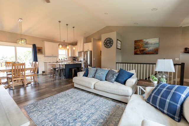 695 Marcus Pl NE, Byron, MN 55920 - living room featuring vaulted ceiling and wood finished floors