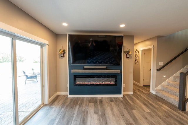 695 Marcus Pl NE, Byron, MN 55920 - detailed view of wood finished floors, a fireplace, and recessed lighting