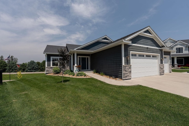 695 Marcus Pl NE, Byron, MN 55920 - craftsman inspired home featuring an attached garage, stone siding, a front yard, and driveway