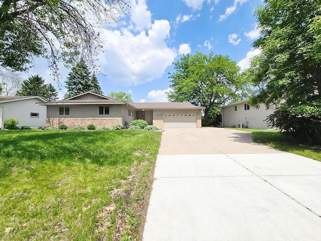 1420 17th St W, Hastings, MN 55033 - single story home featuring an attached garage, driveway, a front yard, and stone siding