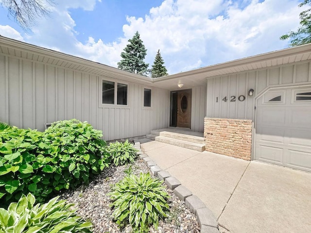 1420 17th St W, Hastings, MN 55033 - doorway to property with board and batten siding