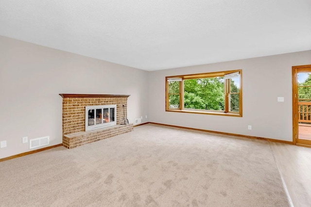1420 17th St W, Hastings, MN 55033 - unfurnished living room featuring a brick fireplace and carpet flooring