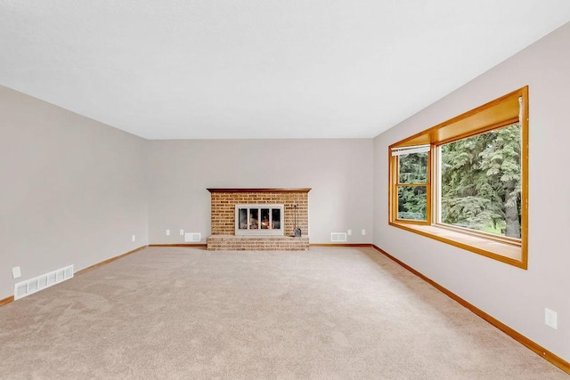 1420 17th St W, Hastings, MN 55033 - unfurnished living room featuring carpet flooring and a brick fireplace
