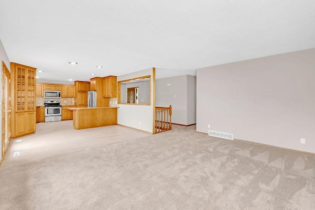 1420 17th St W, Hastings, MN 55033 - unfurnished living room with light colored carpet and recessed lighting
