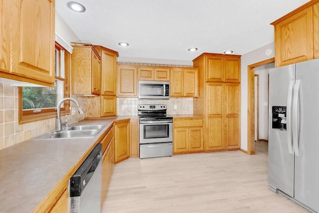 1420 17th St W, Hastings, MN 55033 - kitchen with stainless steel appliances, backsplash, light wood-style flooring, light countertops, and recessed lighting