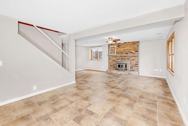 1420 17th St W, Hastings, MN 55033 - unfurnished living room with a ceiling fan, light tile patterned floors, and a fireplace