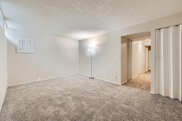 455 107th Ln NW, Coon Rapids, MN 55448 - carpeted spare room with a textured ceiling and baseboards