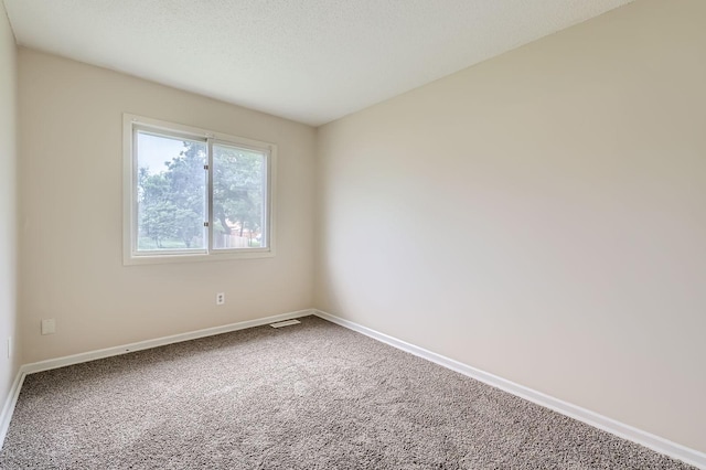 455 107th Ln NW, Coon Rapids, MN 55448 - carpeted spare room featuring baseboards