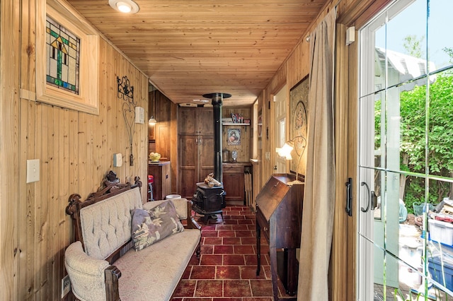 3231 41st Ave S, Minneapolis, MN 55406 - hallway featuring wood walls, wooden ceiling, and dark tile patterned floors