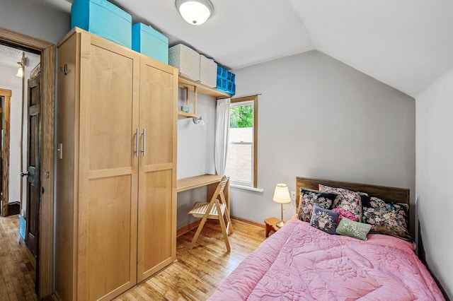 3231 41st Ave S, Minneapolis, MN 55406 - bedroom featuring light wood finished floors and lofted ceiling