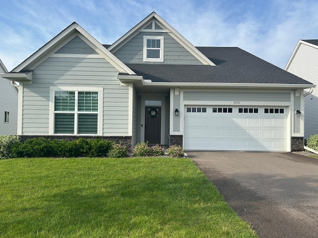 8756 151st Ave NW, Ramsey, MN 55303 - craftsman inspired home with stone siding, driveway, a front lawn, and an attached garage