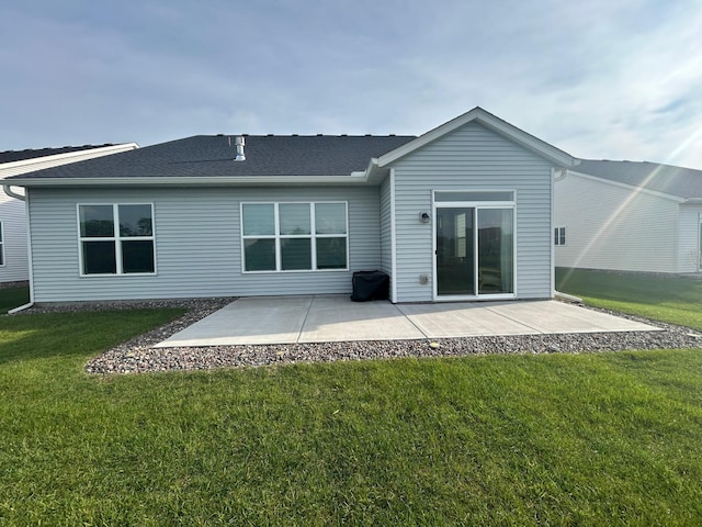 8756 151st Ave NW, Ramsey, MN 55303 - back of property with a patio area, a lawn, and a shingled roof