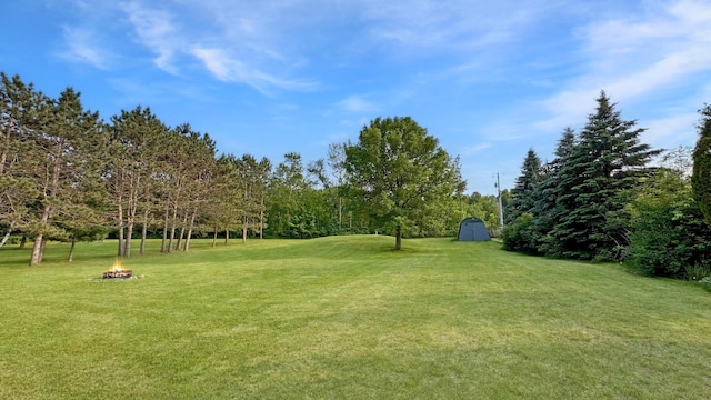 12833 Twilight Rd, South Harbor Twp, MN 56359 - view of green lawn featuring an outdoor fire pit