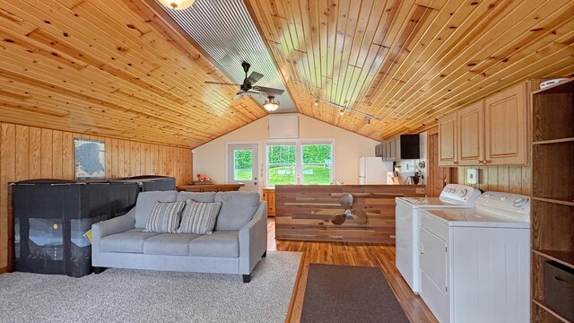 12833 Twilight Rd, South Harbor Twp, MN 56359 - washroom with washer and dryer, cabinet space, a ceiling fan, wooden walls, and wooden ceiling