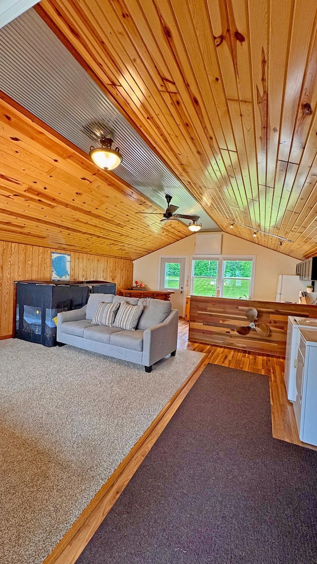 12833 Twilight Rd, South Harbor Twp, MN 56359 - living room featuring lofted ceiling, wood finished floors, wood ceiling, wooden walls, and a ceiling fan