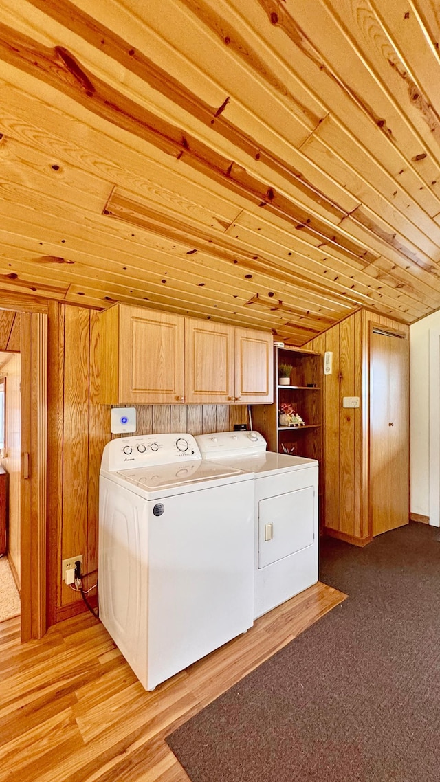 12833 Twilight Rd, South Harbor Twp, MN 56359 - laundry room with washer and clothes dryer, cabinet space, wooden ceiling, and wood walls
