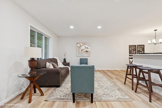 9019 Idaho Ave N, Brooklyn Park, MN 55445 - living room featuring light wood-style flooring, a chandelier, and recessed lighting