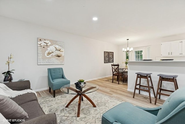 9019 Idaho Ave N, Brooklyn Park, MN 55445 - living area featuring a chandelier, light wood-style floors, and recessed lighting