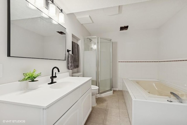 9019 Idaho Ave N, Brooklyn Park, MN 55445 - bathroom featuring vanity, a bath, a stall shower, and tile patterned floors
