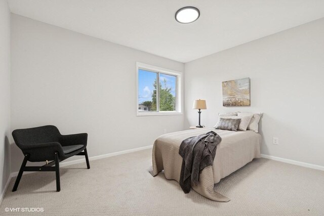 9019 Idaho Ave N, Brooklyn Park, MN 55445 - bedroom featuring baseboards and light carpet