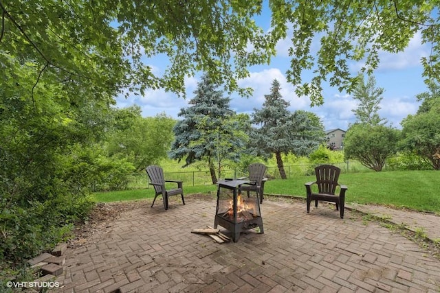 9019 Idaho Ave N, Brooklyn Park, MN 55445 - view of patio / terrace with a fire pit