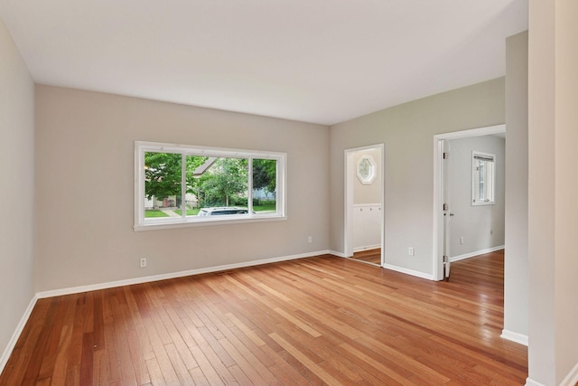 724 Pierce St NE, Minneapolis, MN 55413 - spare room featuring light wood-type flooring and baseboards