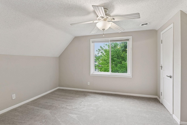 724 Pierce St NE, Minneapolis, MN 55413 - additional living space with a textured ceiling, carpet flooring, vaulted ceiling, and ceiling fan
