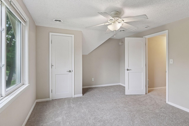 724 Pierce St NE, Minneapolis, MN 55413 - additional living space with carpet flooring, healthy amount of natural light, a textured ceiling, and a ceiling fan