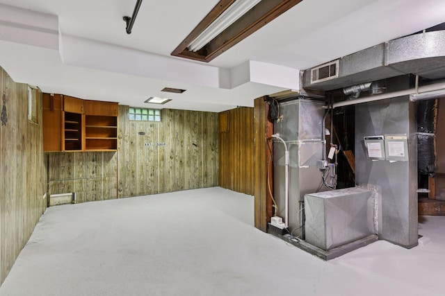 724 Pierce St NE, Minneapolis, MN 55413 - below grade area featuring wood walls and heating unit