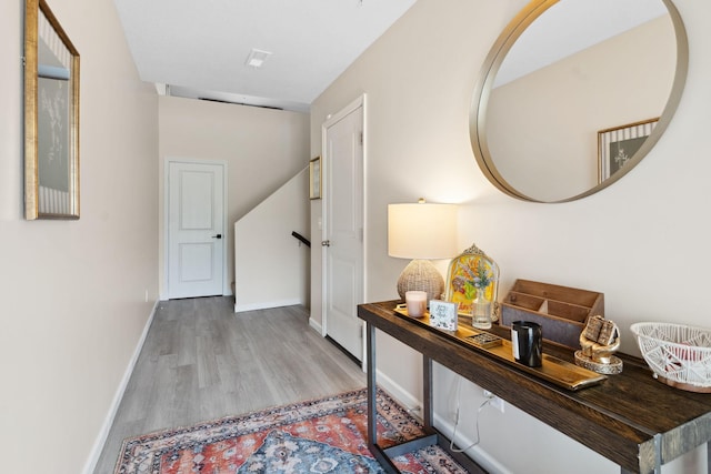 8468 Gateway Cir, Monticello, MN 55362 - hallway featuring wood finished floors and baseboards