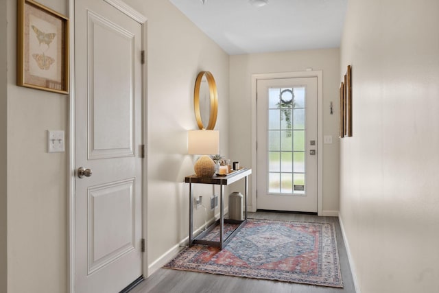 8468 Gateway Cir, Monticello, MN 55362 - doorway with baseboards and wood finished floors