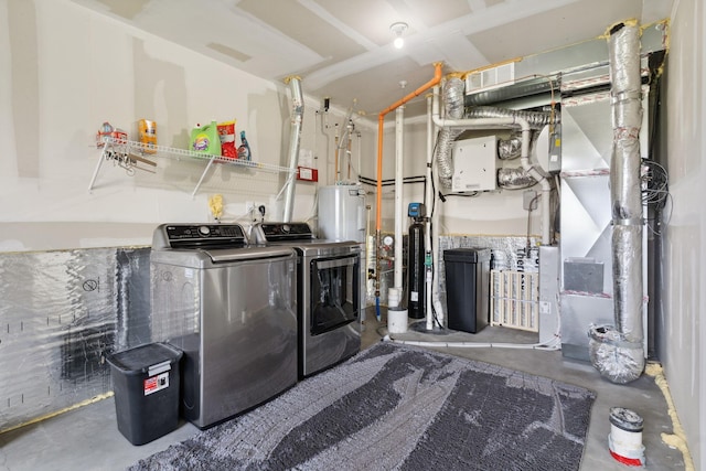 8468 Gateway Cir, Monticello, MN 55362 - laundry area with washer and dryer and electric water heater